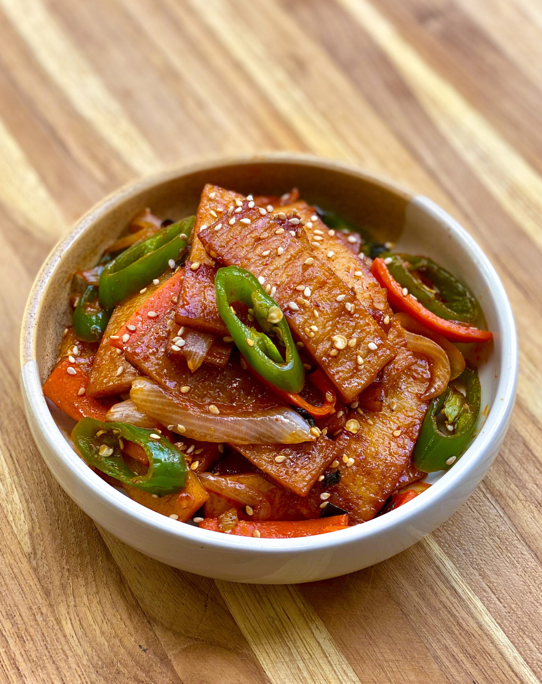 Freshly made stir fried fish cakes with jalapenos, carrots, and onions