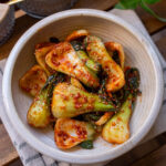 bok choy seasoned in a korean red sauce (bok choy kimchi)