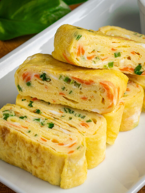 gyeran mari (Korean rolled omelette) with green onions and shredded carrots.