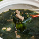 a pot of miyeok guk (Korean seaweed soup) made with beef.