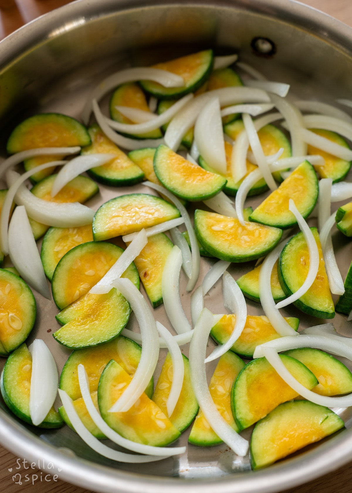 saute zucchini and onions in oil