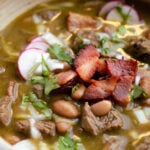 a bowl of hot carne en su jugo with toppings