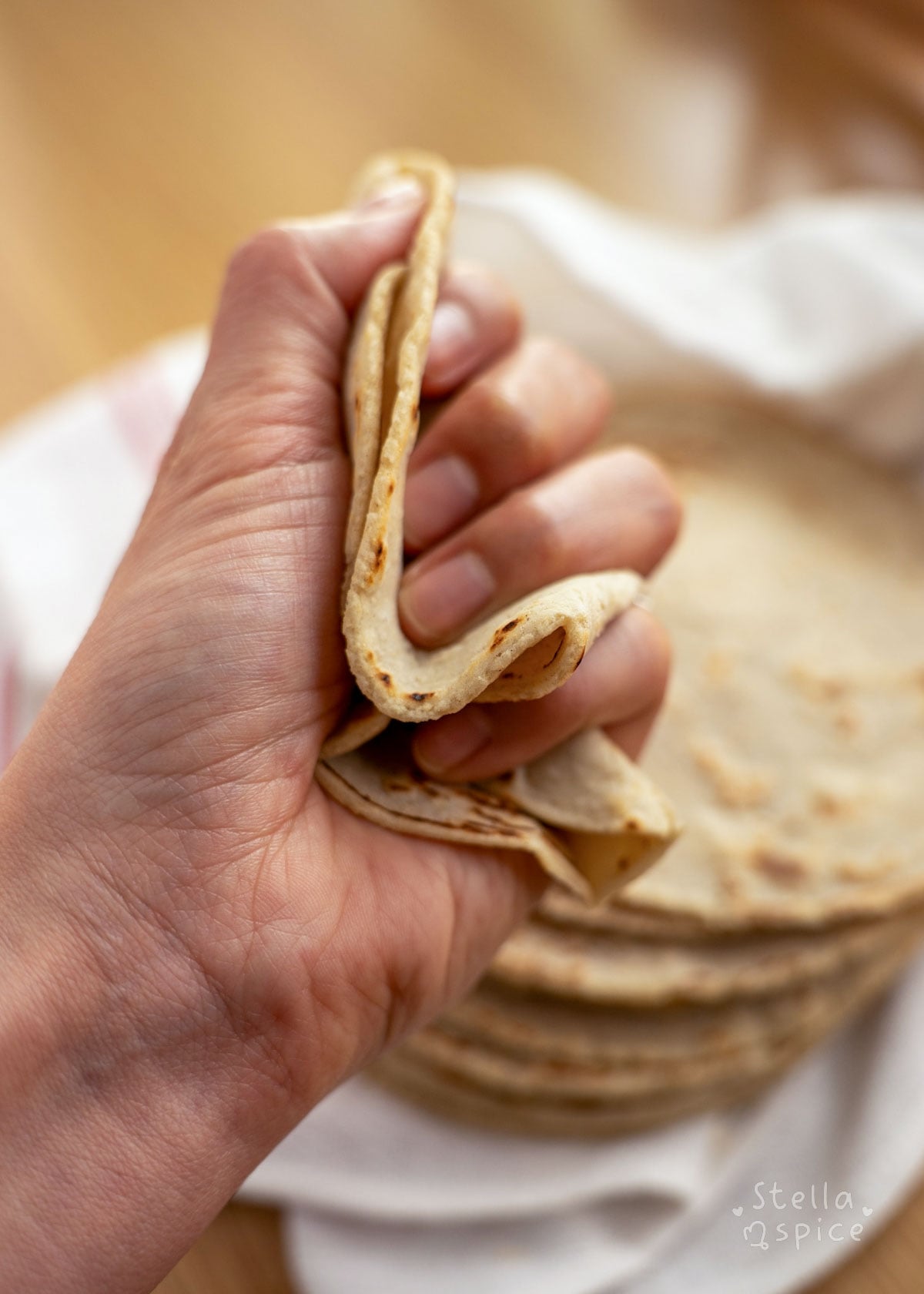 corn tortilla crumpled in hand (crumple test)