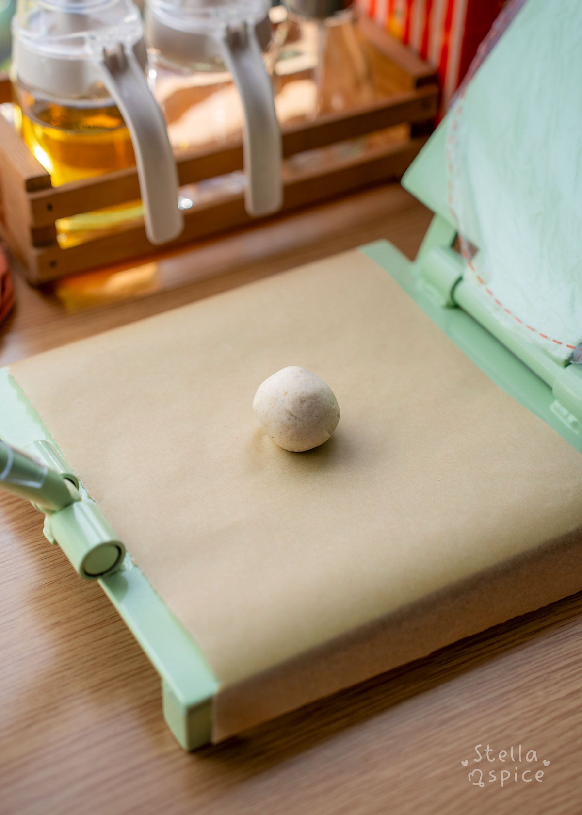 ball of masa on tortilla press
