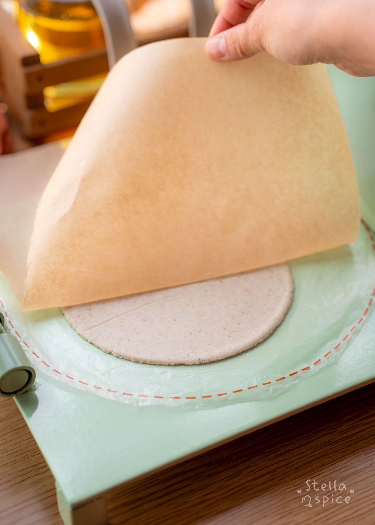 pressed tortilla (other side) and peeling parchment paper off