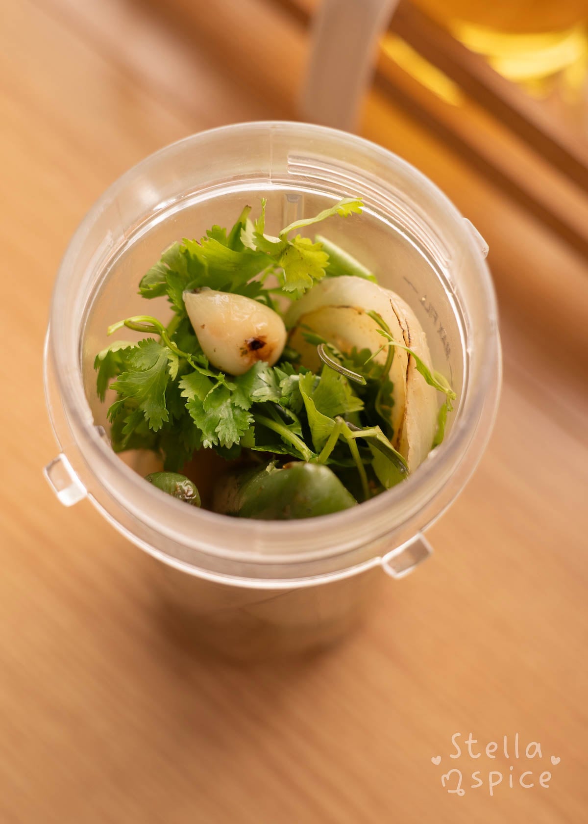 ingredients added to a blender with fresh cilantro