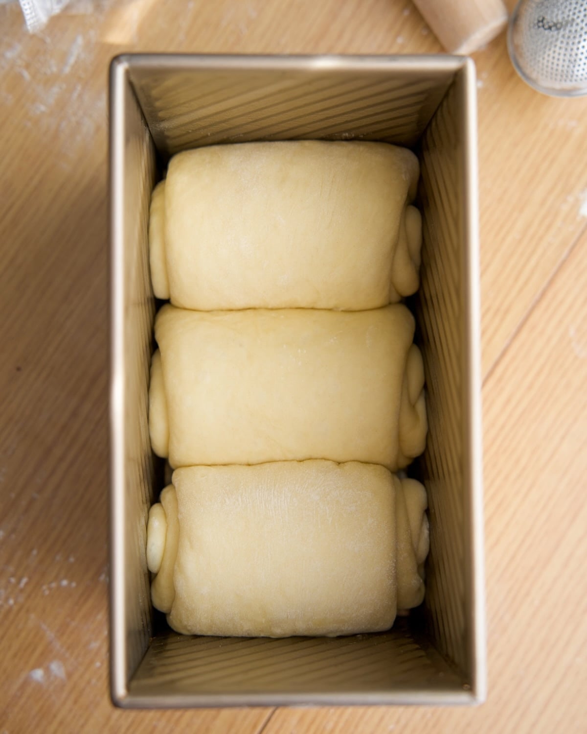 three rolled up pieces of dough