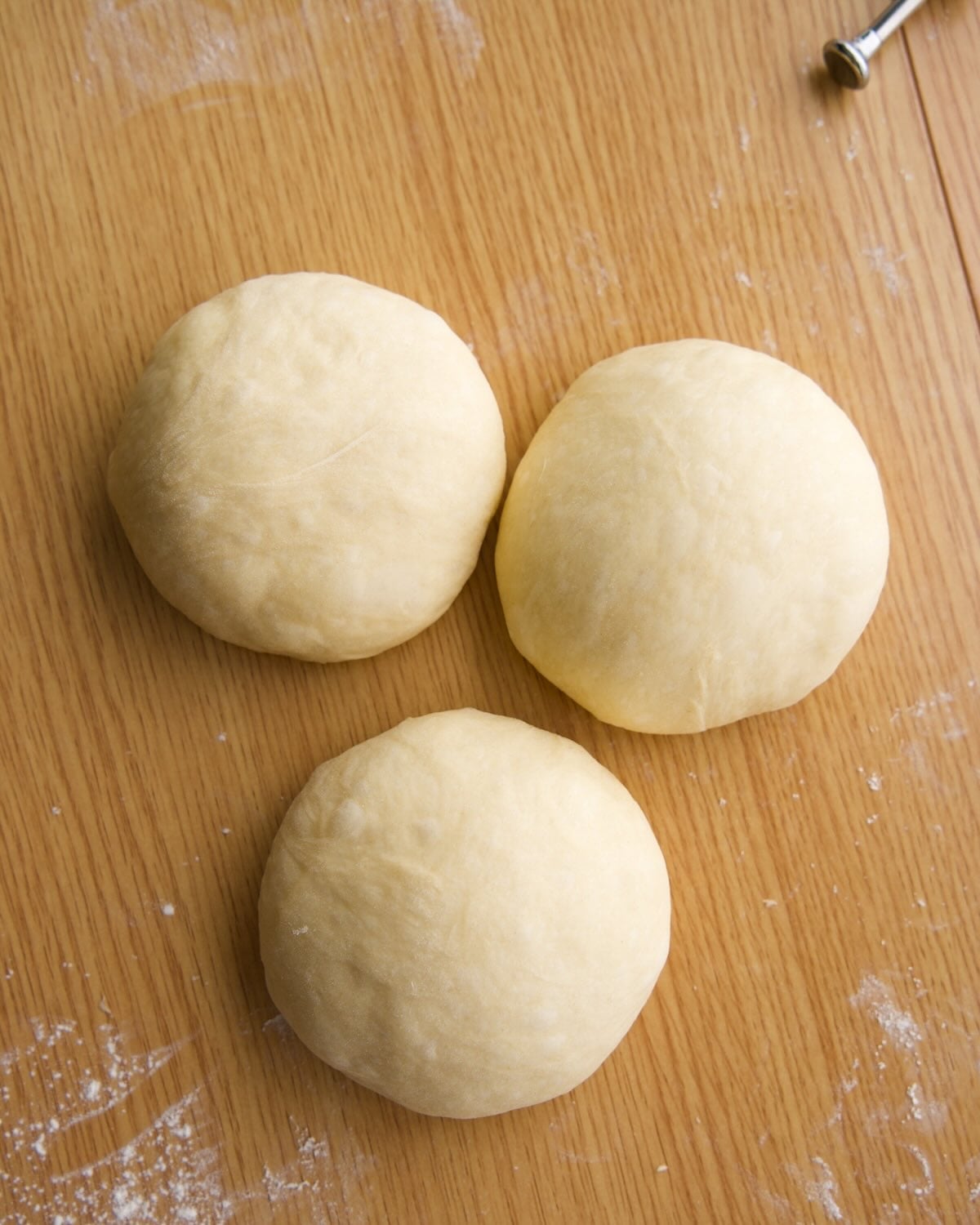 dough divided and preshaped into 3 balls