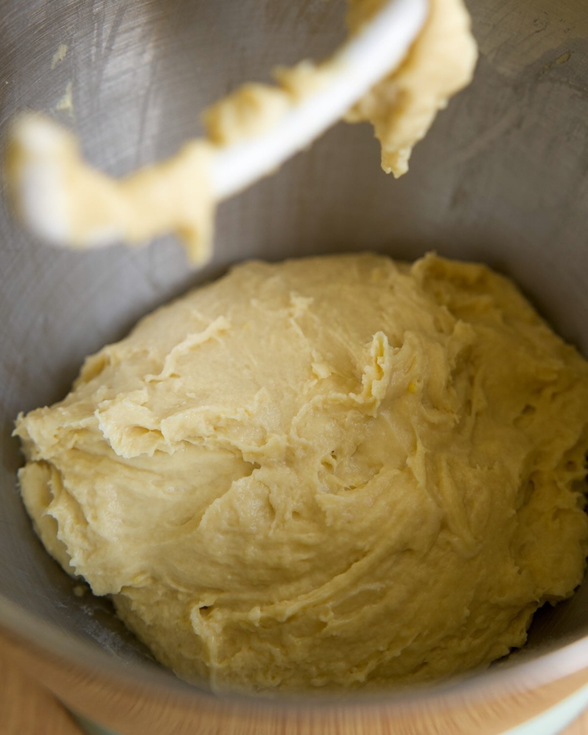 dough has come together in a mixing bowl, with sides scraped down